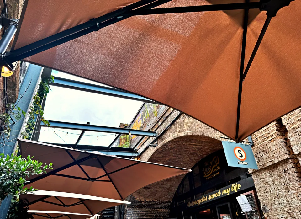 Courtyard umbrellas and brick architecture