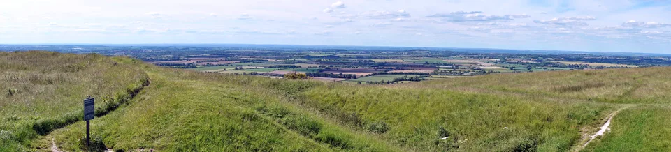 Panoramic view across green hills