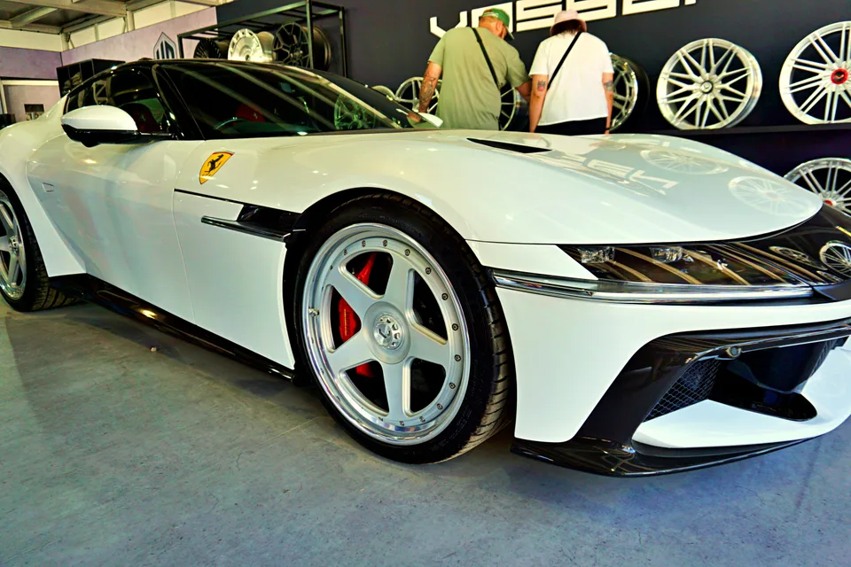 White Ferrari and polished five-spoke wheels