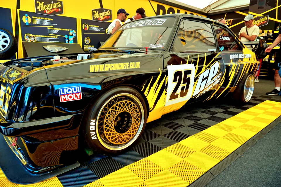 Black and gold racing saloon