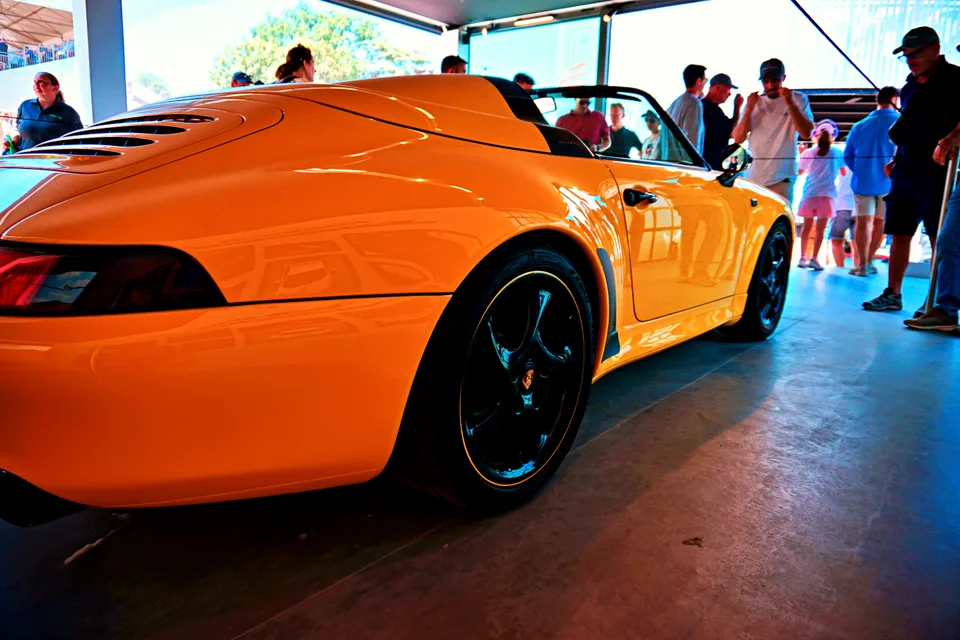 Orange Porsche Speedster, rear three-quarter view